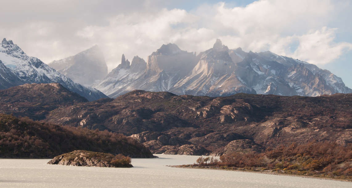 Breathtaking view of the snowy mountains under the cloudy sky in Patagonia, Chile