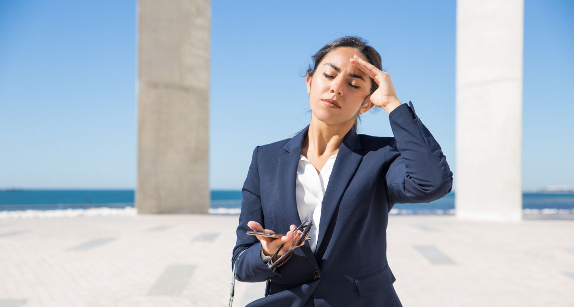 Frustrated business lady suffering from heat