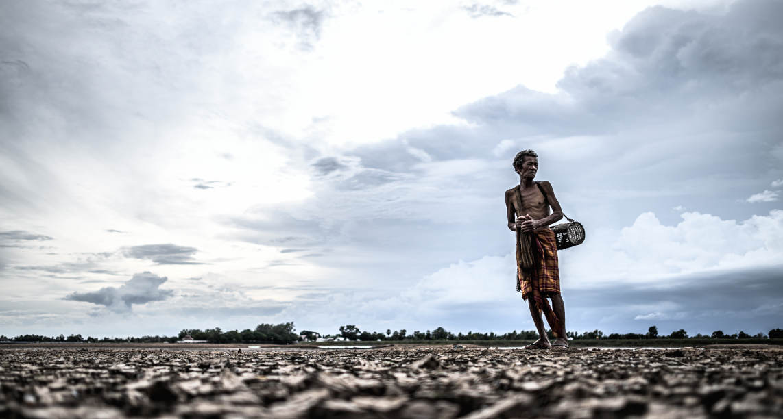 Elderly men find fish on dry ground,global warming